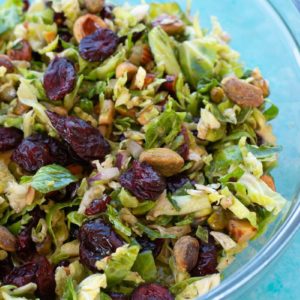 This Shaved Brussels Sprouts Salad is the best no-cook, meal prep dish! This healthy, easy salad is perfect for lunch, potlucks, holiday parties, and more!
