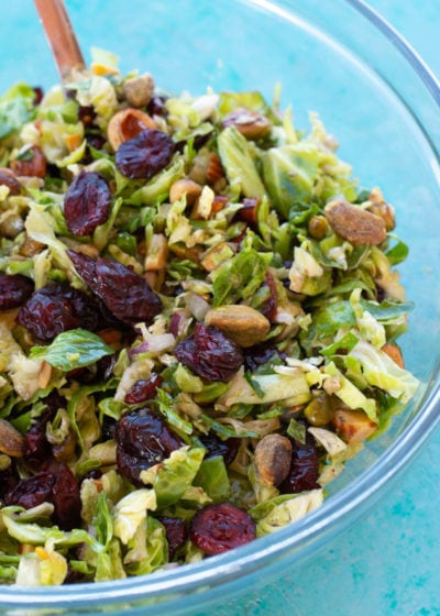 This Shaved Brussels Sprouts Salad is the best no-cook, meal prep dish! This healthy, easy salad is perfect for lunch, potlucks, holiday parties, and more!