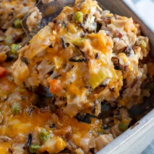 turkey casserole being scooped out of casserole dish