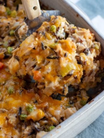 turkey casserole being scooped out of casserole dish