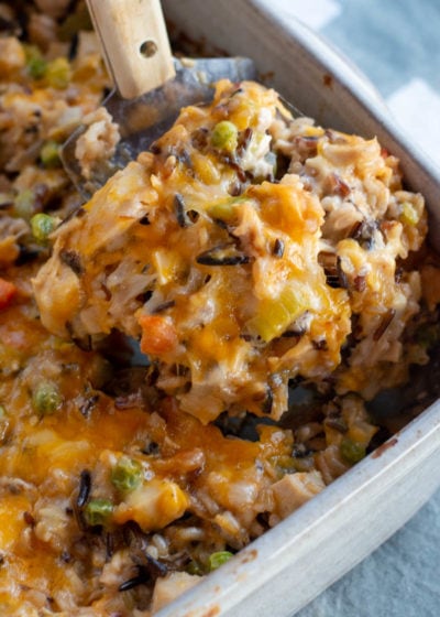 turkey casserole being scooped out of casserole dish