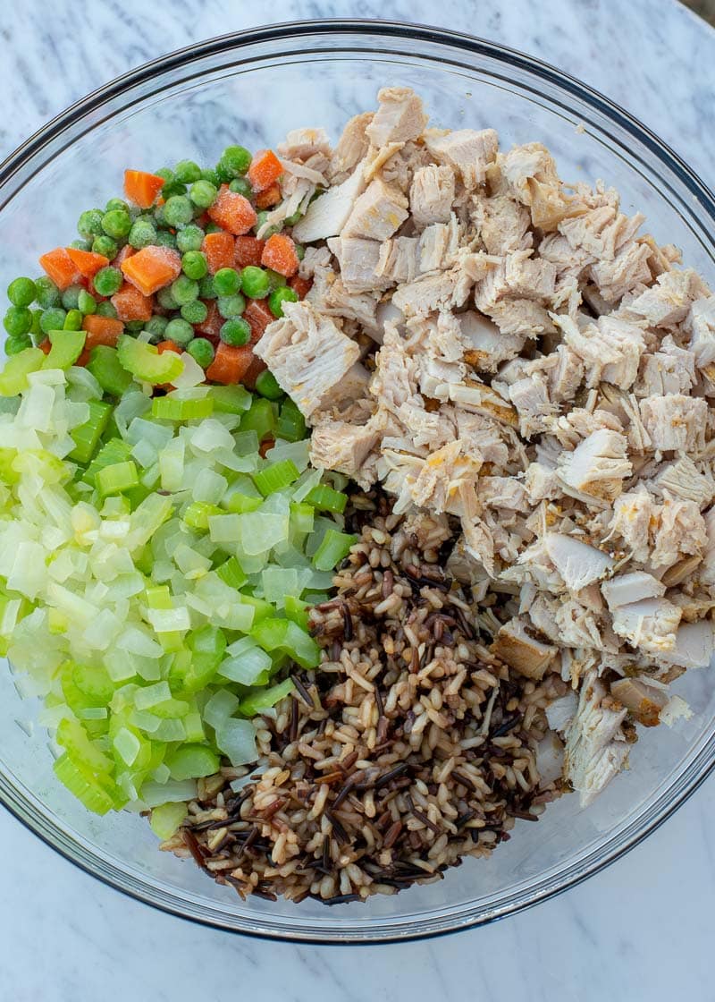 turkey casserole ingredients in a clear mixing bowl