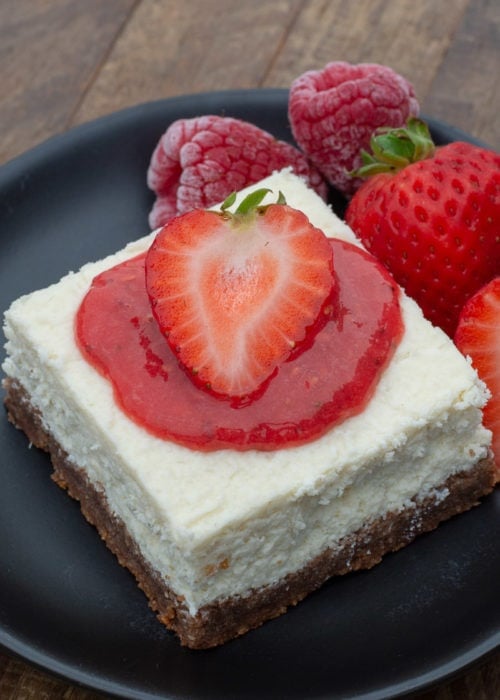 These Cheesecake Bars feature a sweet, buttery crust and smooth and creamy vanilla cheesecake filling! This is the perfect keto cheesecake recipe that is great by itself or with your favorite toppings!