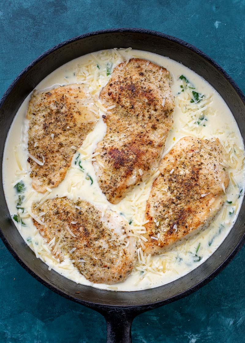 This easy Chicken Florentine recipe features herb crusted chicken and spinach with a rich and creamy wine wine sauce. This one pan dish is ready in under 30 minutes and is low carb and keto-friendly!