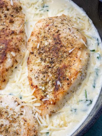 This easy Chicken Florentine recipe features herb crusted chicken and spinach with a rich and creamy wine wine sauce. This one pan dish is ready in under 30 minutes and is low carb and keto-friendly!
