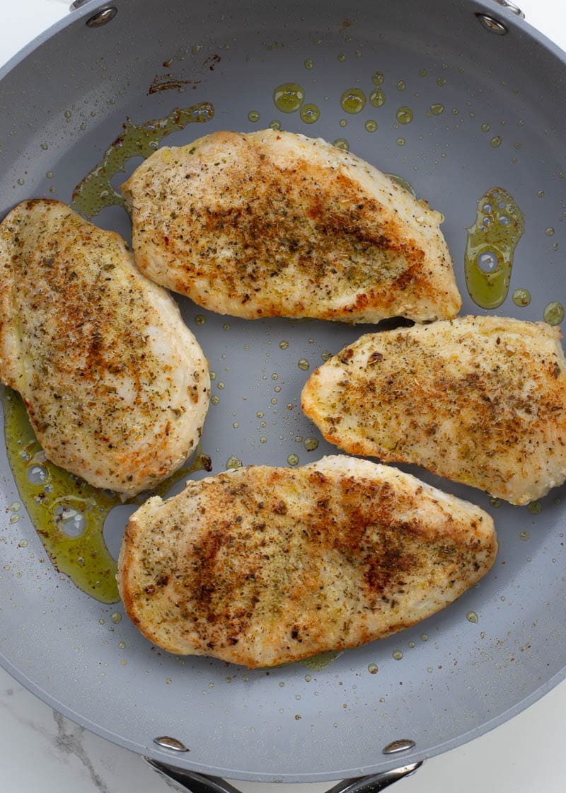 This easy Chicken Florentine recipe features herb crusted chicken and spinach with a rich and creamy wine wine sauce. This one pan dish is ready in under 30 minutes and is low carb and keto-friendly!