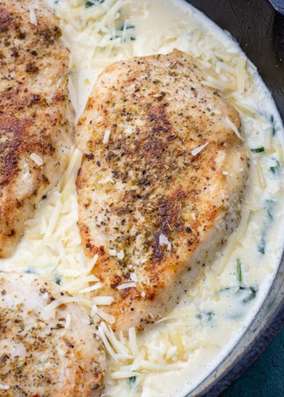 This easy Chicken Florentine recipe features herb crusted chicken and spinach with a rich and creamy wine wine sauce. This one pan dish is ready in under 30 minutes and is low carb and keto-friendly!