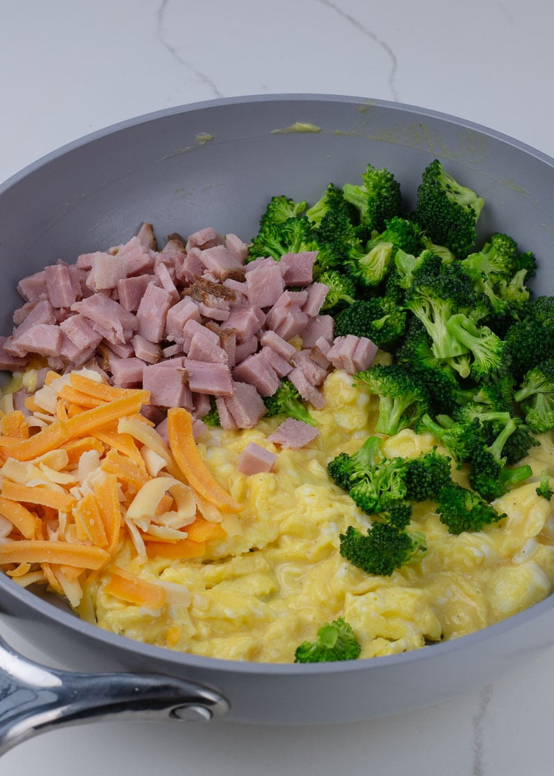 This Ham, Broccoli and Cheese Scramble is a hearty breakfast that will keep you full all day! These fluffy scrambled eggs are the perfect low carb, keto-friendly breakfast!