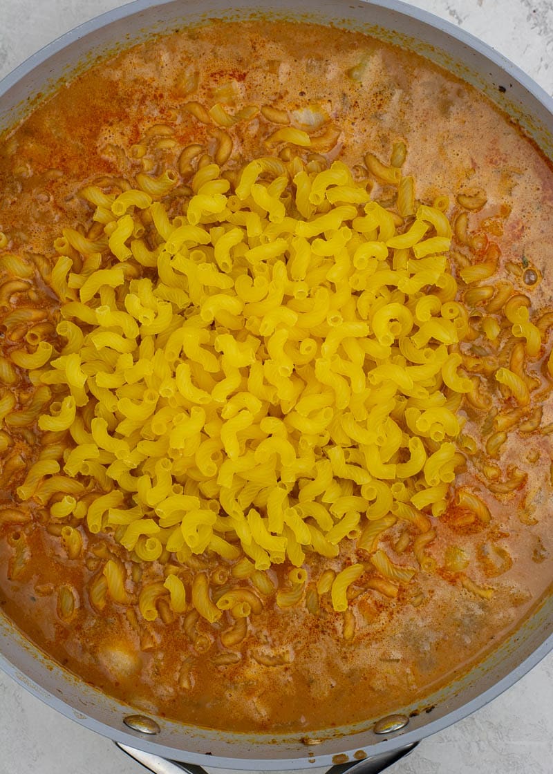 gluten free elbow macaroni noodles added into the ground beef and tomato mixture