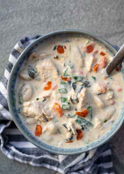 This creamy Chicken Gnocchi Soup recipe is the perfect comfort food! Tender chicken is paired with vegetables and gnocchi for a hearty, healthy meal!