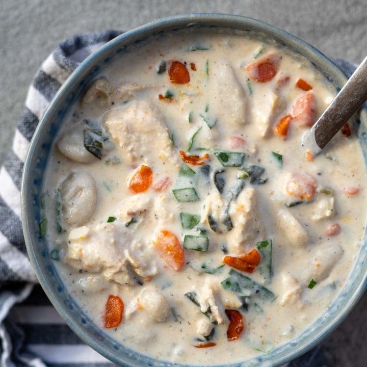 This creamy Chicken Gnocchi Soup recipe is the perfect comfort food! Tender chicken is paired with vegetables and gnocchi for a hearty, healthy meal!