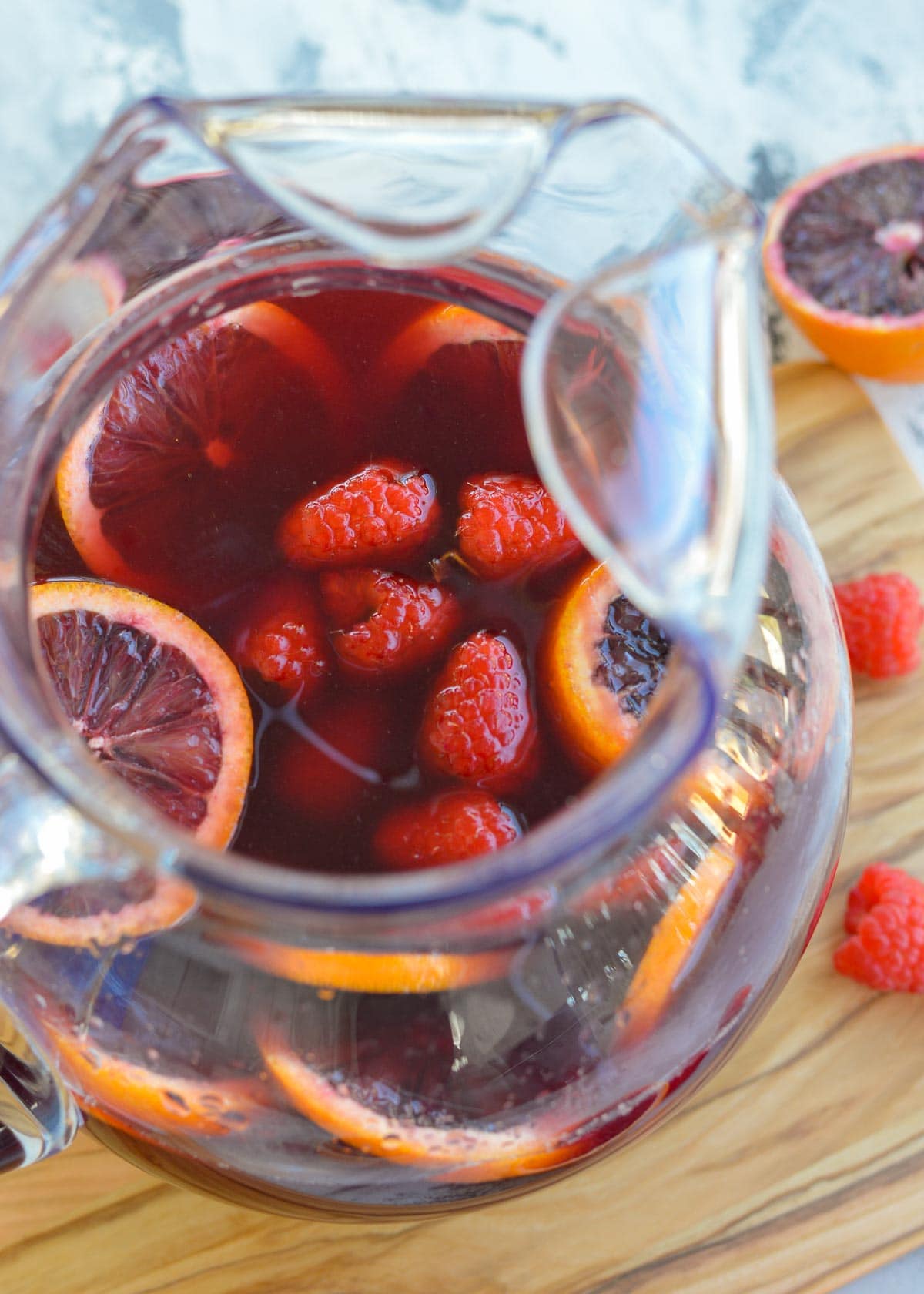 This delicious Blood Orange Raspberry Sangria is perfect for the red wine lover. It's the best cocktail for beautiful brunch and bridal shower menus!