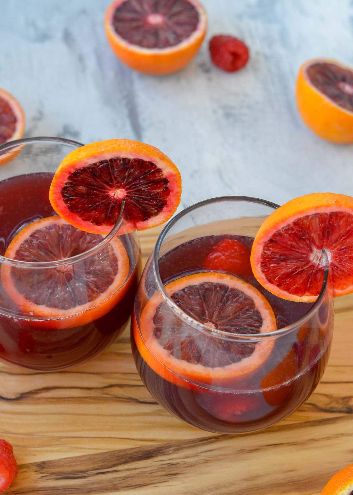 This delicious Blood Orange Raspberry Sangria is perfect for the red wine lover. It's the best cocktail for beautiful brunch and bridal shower menus!