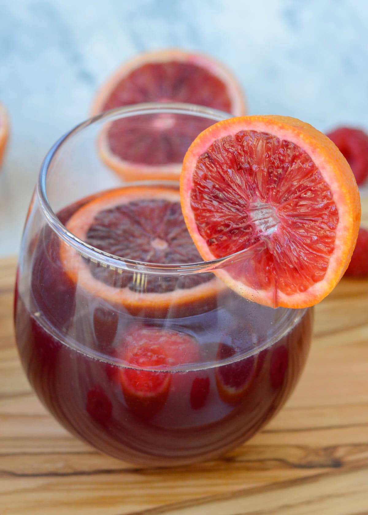 This delicious Blood Orange Raspberry Sangria is perfect for the red wine lover. It's the best cocktail for beautiful brunch and bridal shower menus!