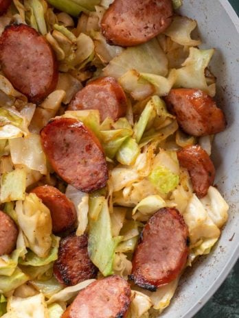 Need an easy low carb, one-pan dinner? I've got you covered! This Keto Sausage and Cabbage Skillet is ready in under 20 minutes and has less than 6 carbs per serving!