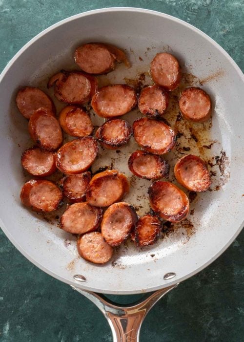 Need an easy low carb, one-pan dinner? I've got you covered! This Keto Sausage and Cabbage Skillet is ready in under 20 minutes and has less than 6 carbs per serving!