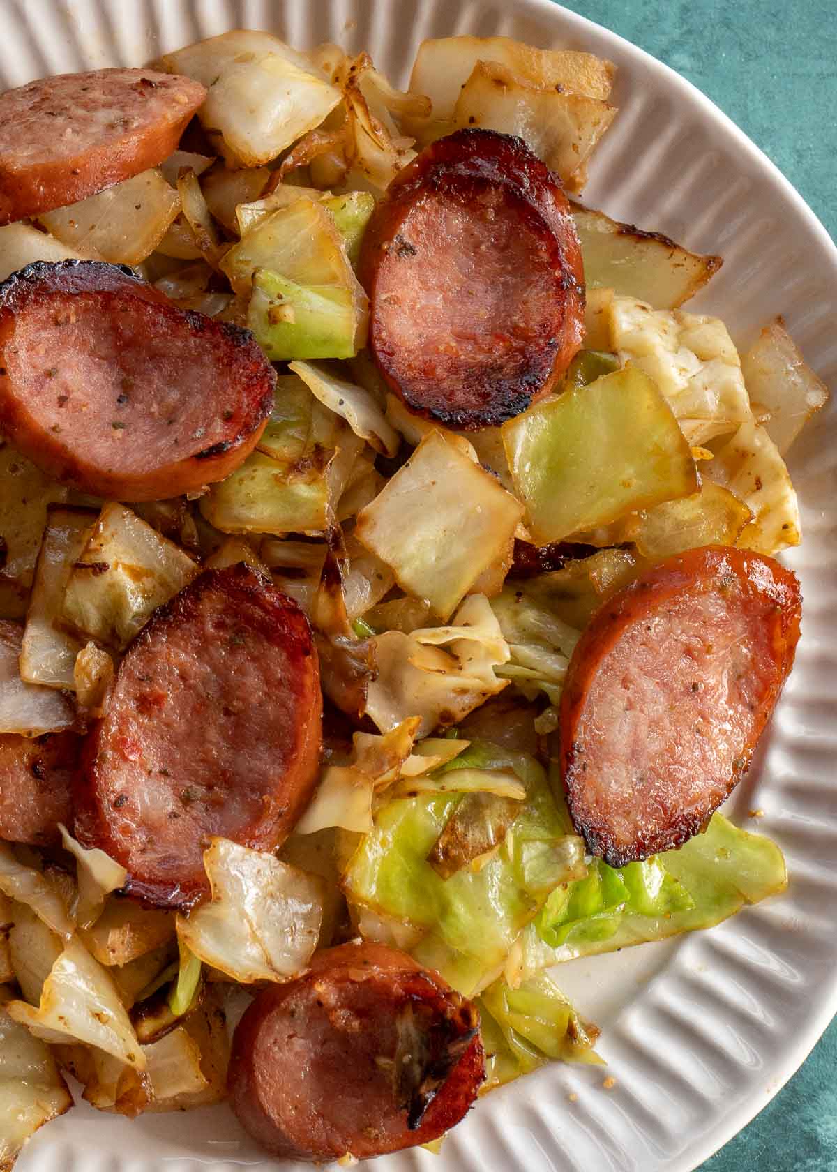 Need an easy low carb, one-pan dinner? I've got you covered! This Keto Sausage and Cabbage Skillet is ready in under 20 minutes and has less than 6 carbs per serving!