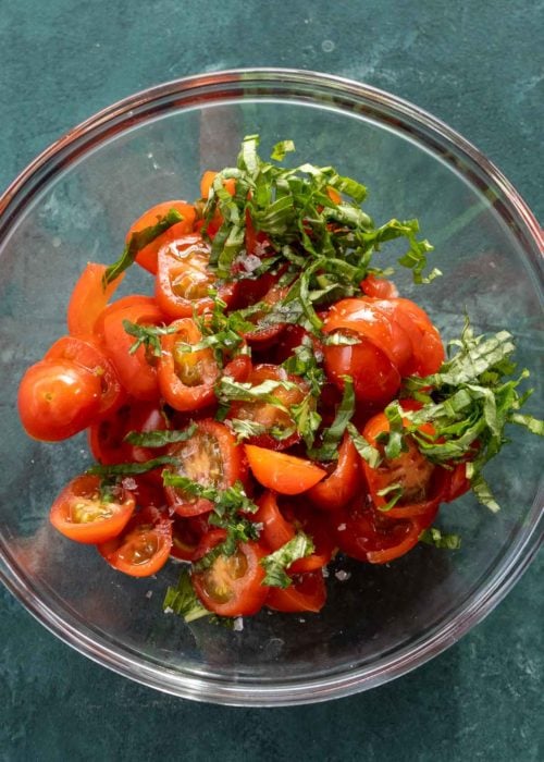 This Chicken Margherita recipe is full of fresh flavors! Balsamic Grilled Chicken is topped with fresh mozzarella, creamy pesto, and a bright tomato basil salad! 