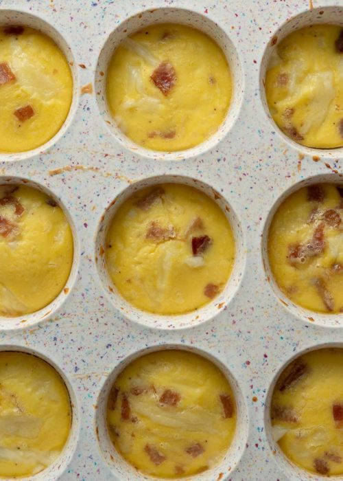 Close up of egg bite dough in a muffin tray