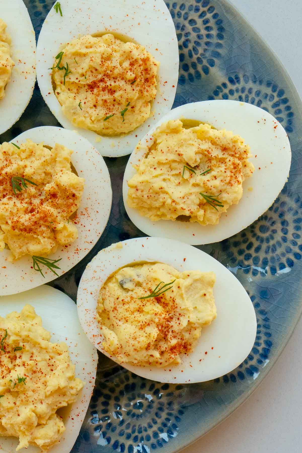 deviled eggs on blue plate