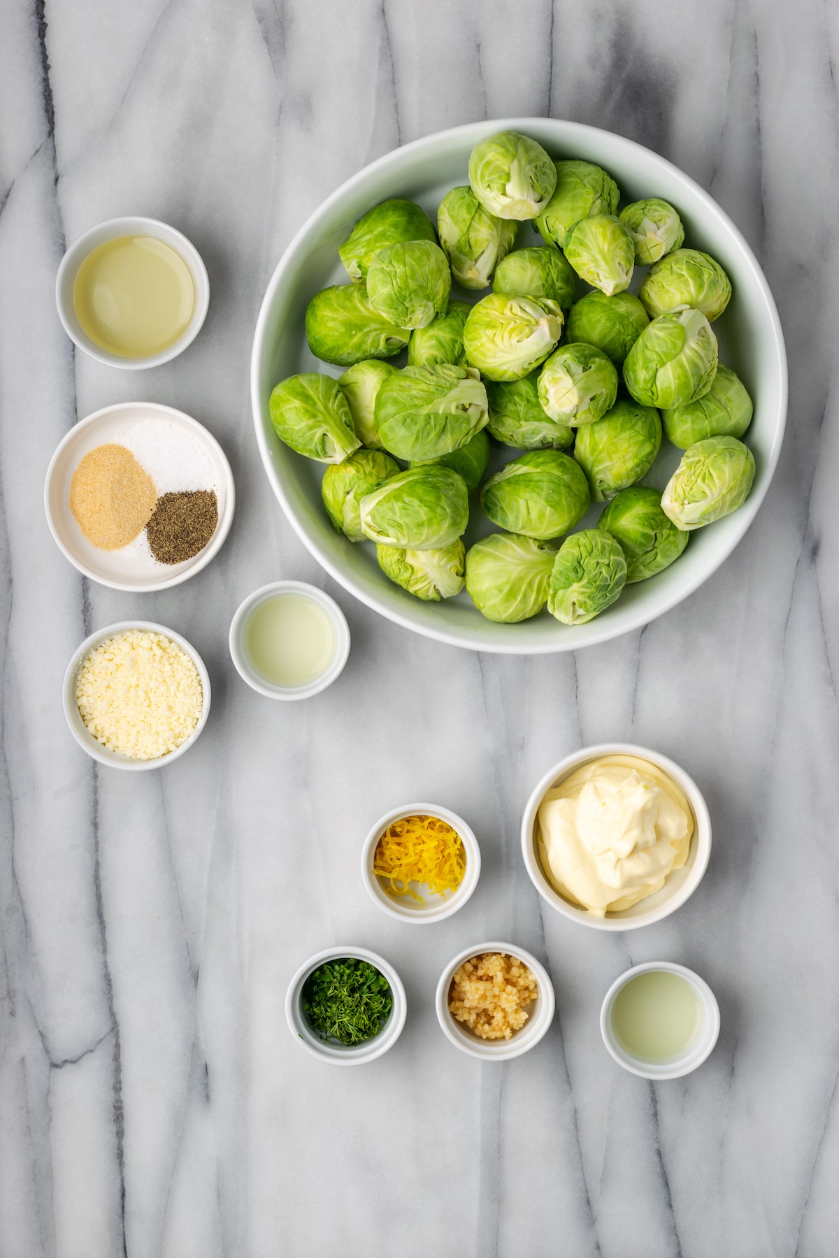 Overhead view of ingredients for smashed Brussels sprouts with lemon aioli