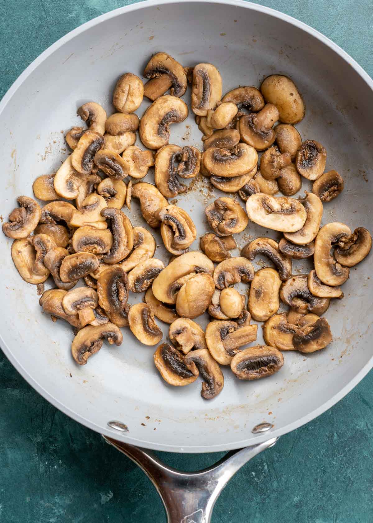 sliced mushrooms in pan