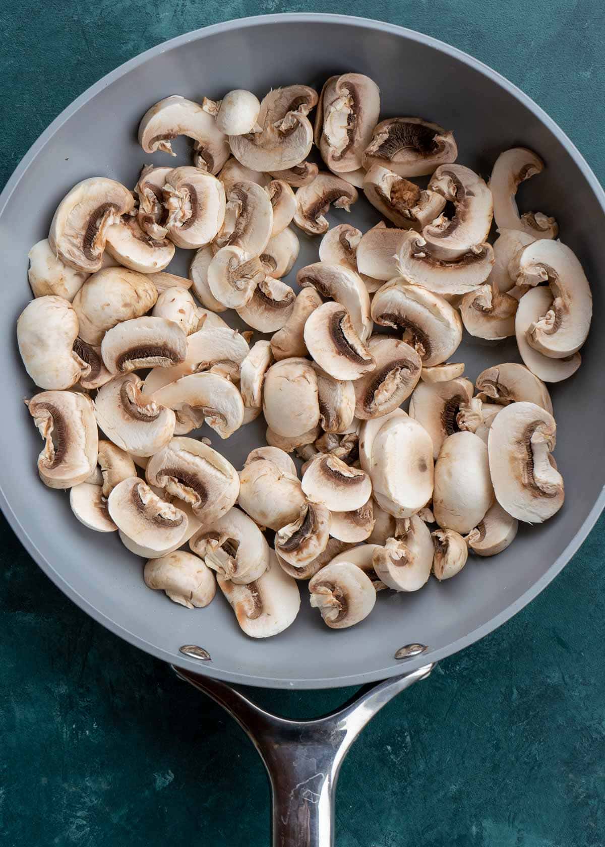 sliced mushrooms in pan