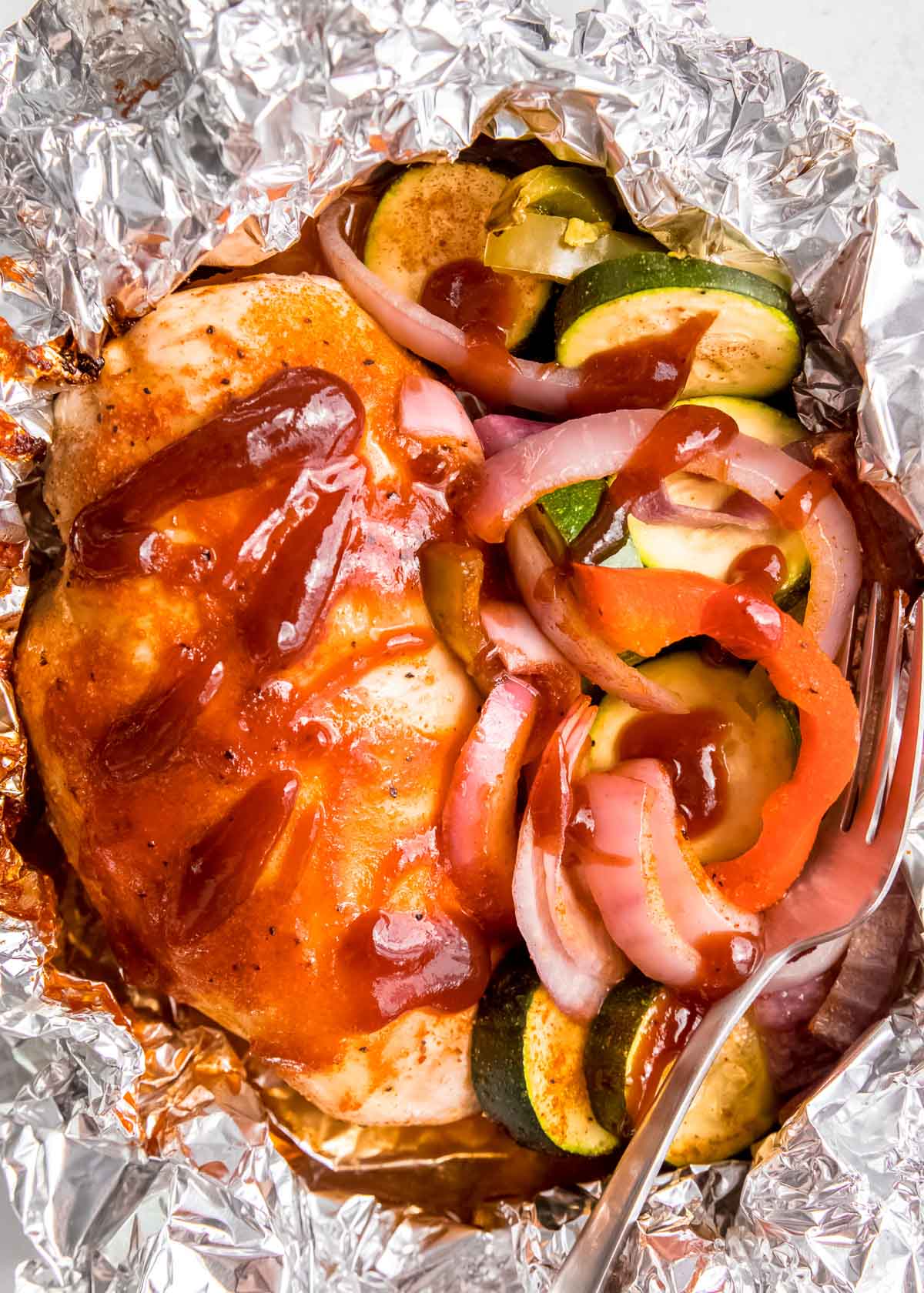 BBQ chicken and vegetables in foil