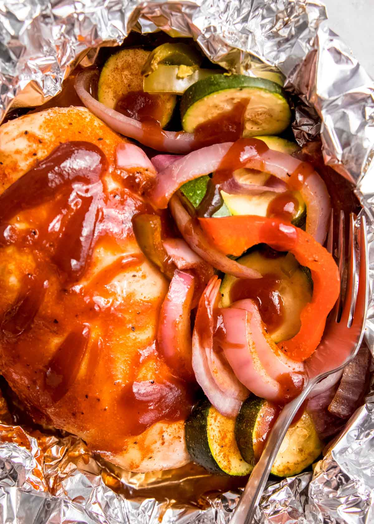 BBQ chicken and vegetables in foil