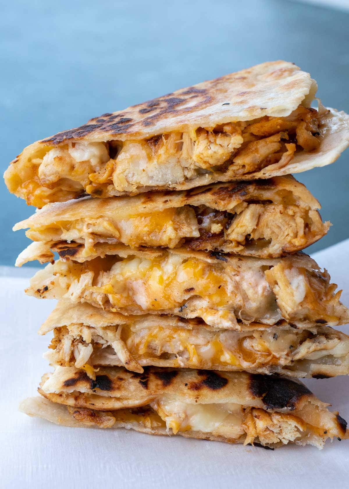 Learn how to make the best Chicken Quesadilla! This easy chicken recipe features a crispy tortilla loaded with two kinds of cheese, tender chicken, and a savory sauce. 