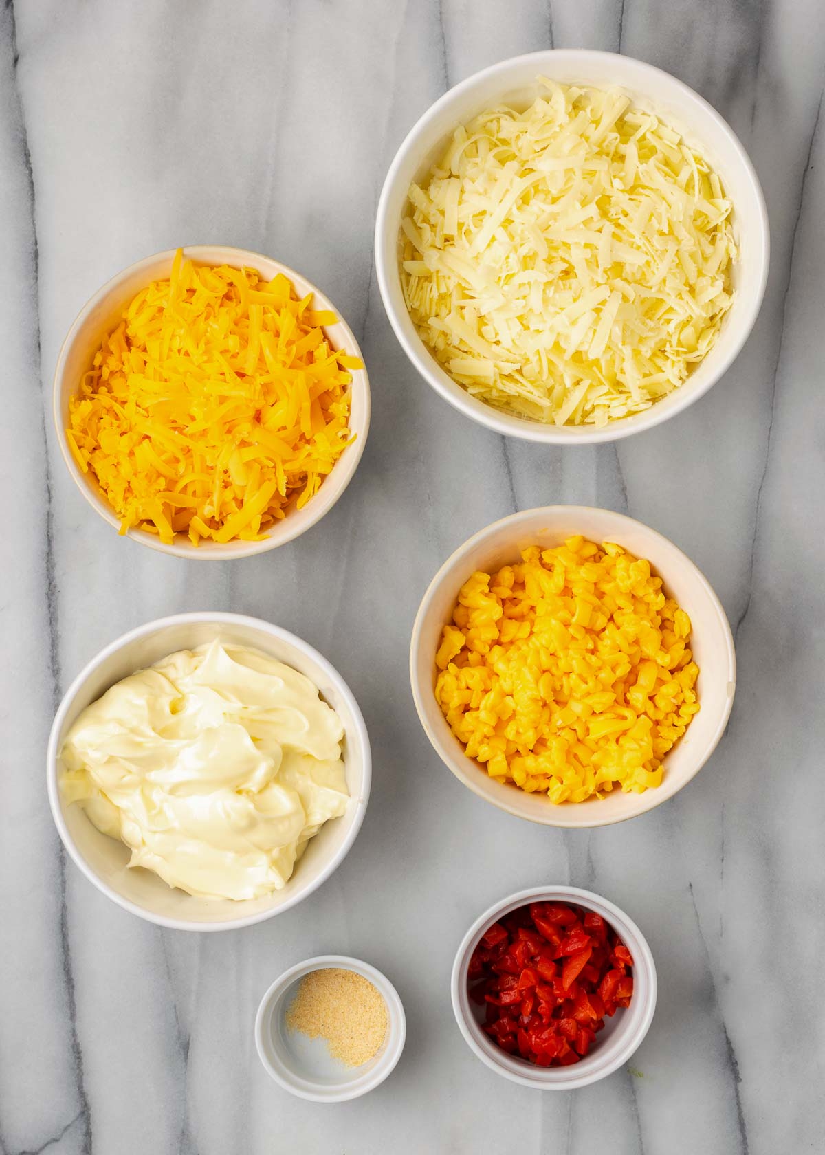 Pimento Cheese ingredients on a white table