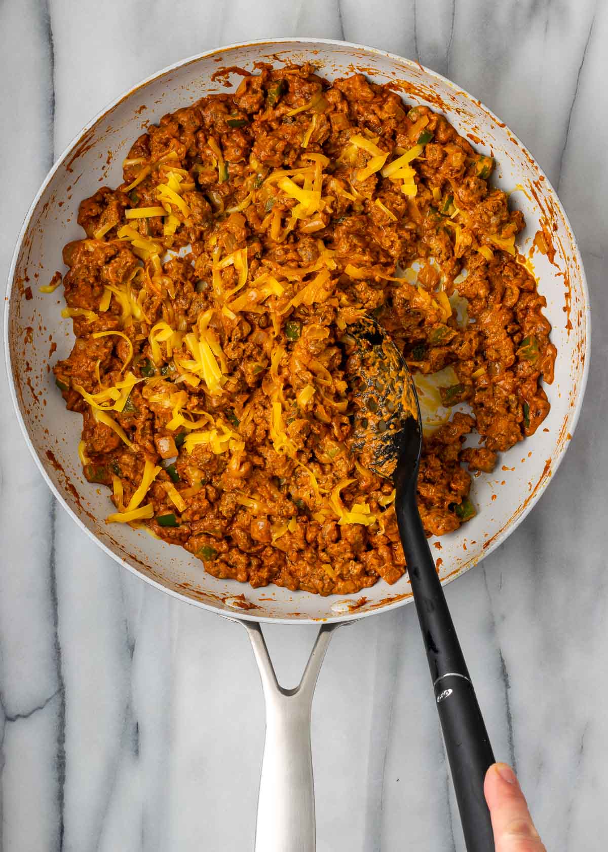 taco meat with cheese in skillet