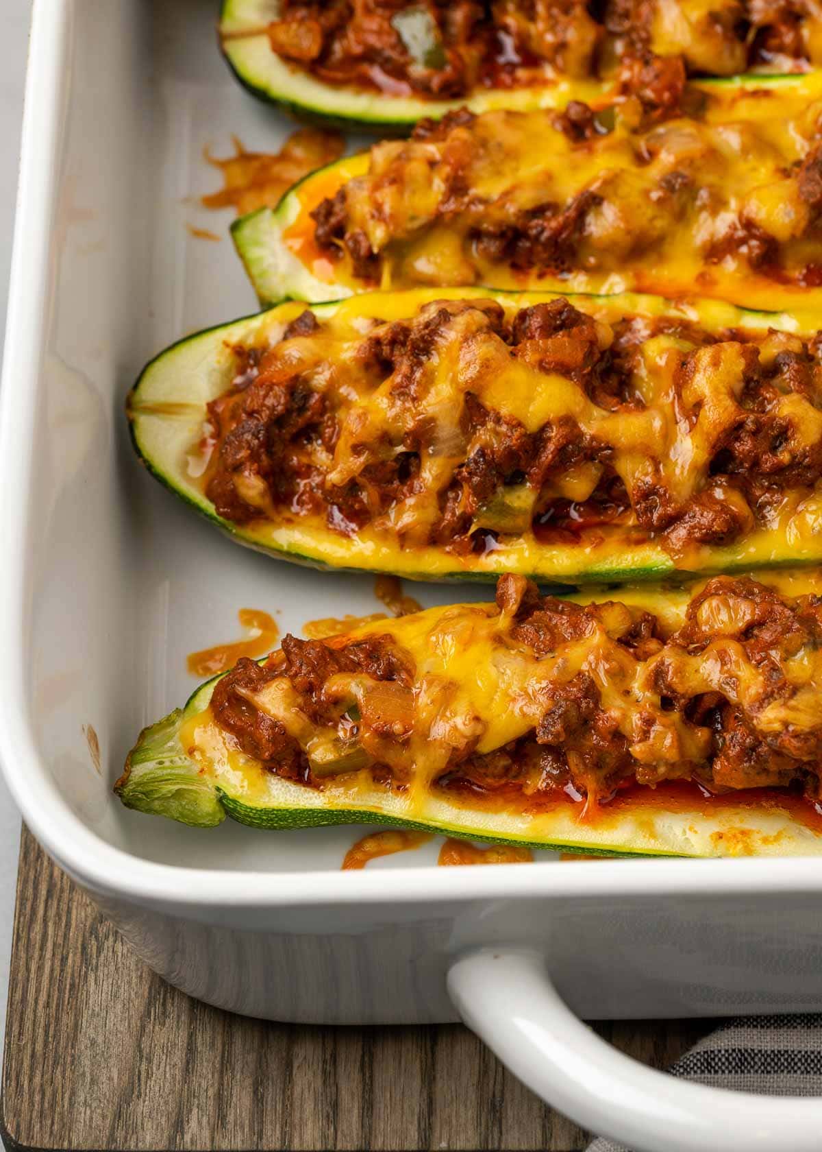 These Mexican Stuffed Zucchini Boats are full of seasoned ground beef, onions, peppers, and lots of melted cheddar cheese. They’re a guaranteed hit with the whole family! 