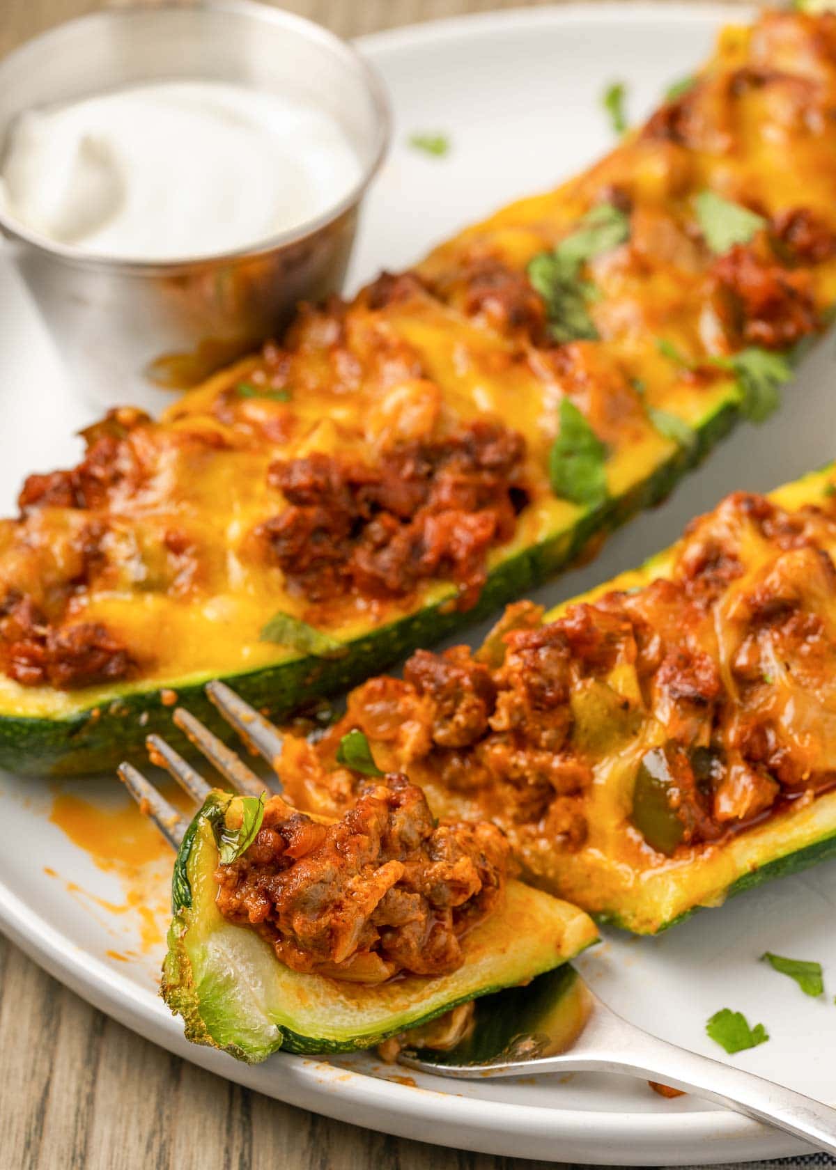 These Mexican Stuffed Zucchini Boats are full of seasoned ground beef, onions, peppers, and lots of melted cheddar cheese. They’re a guaranteed hit with the whole family! 