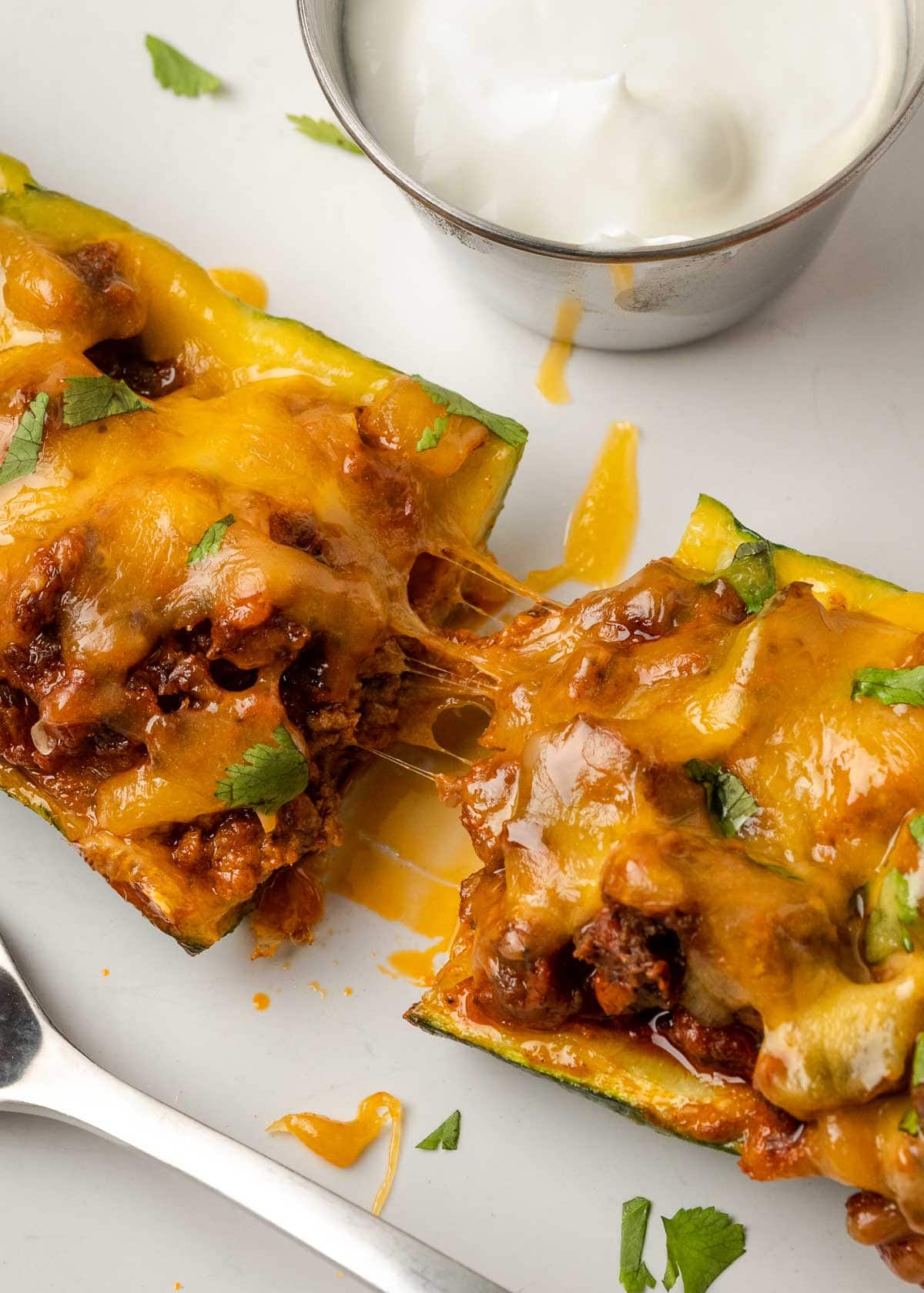 cheese and taco meat in zucchini