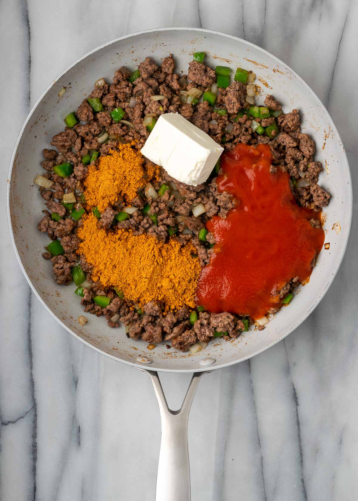 taco seasoning and beef in skillet