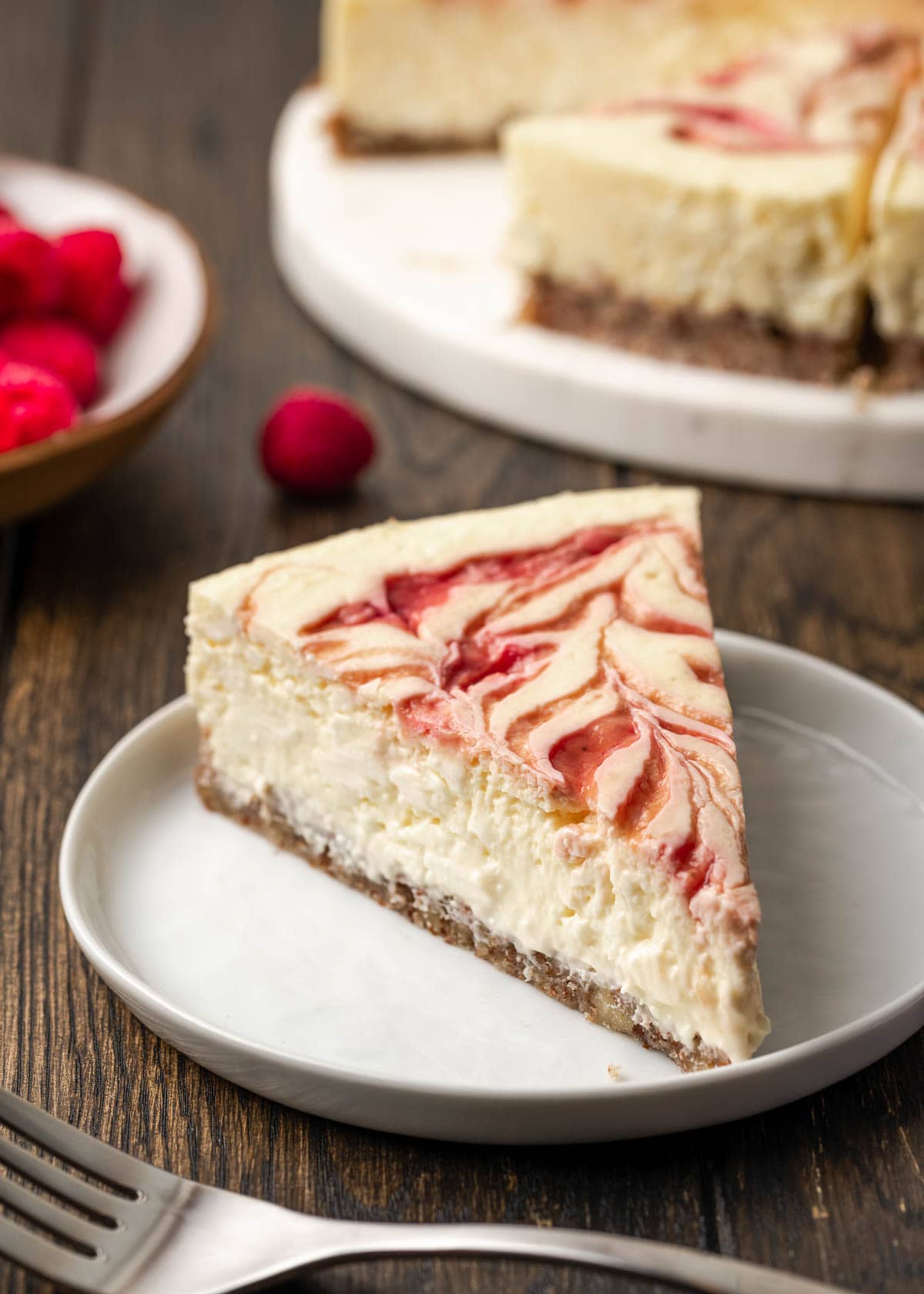 Raspberry cheesecake on plate