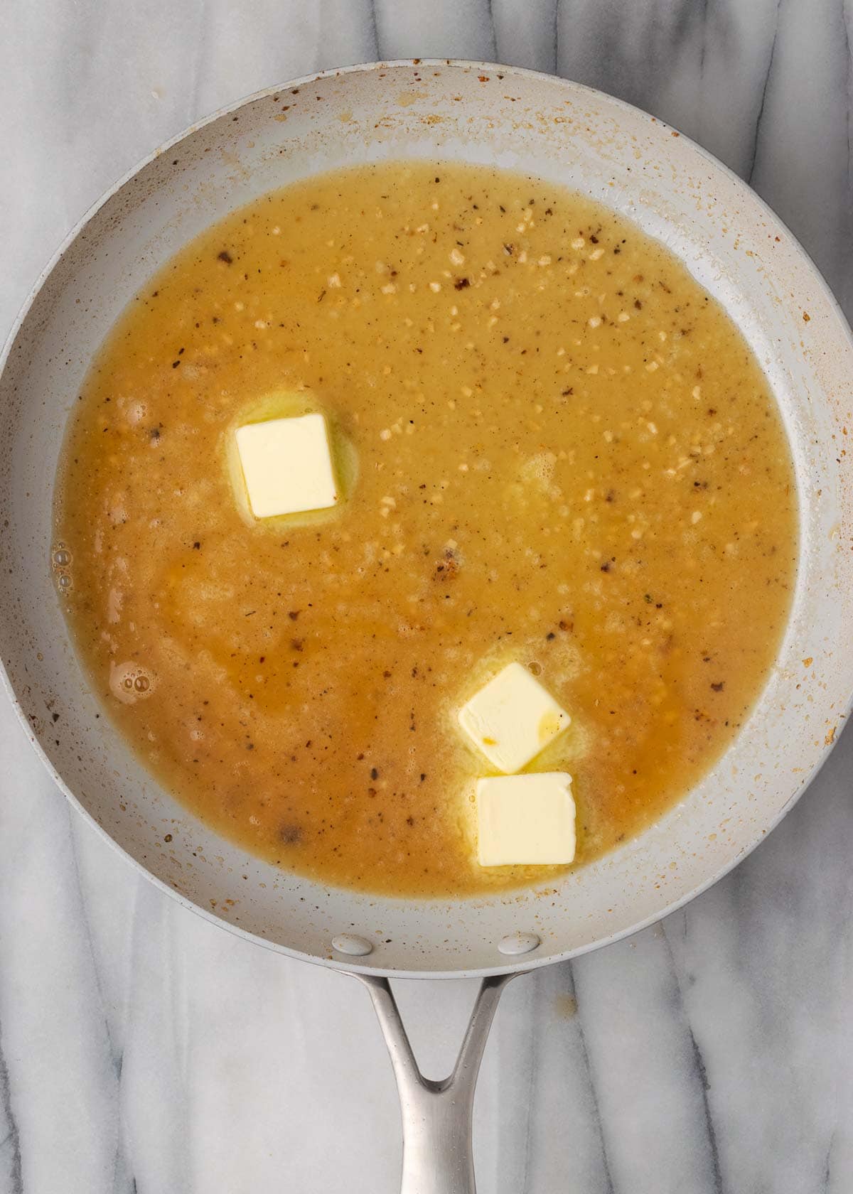 lemon butter sauce in skillet