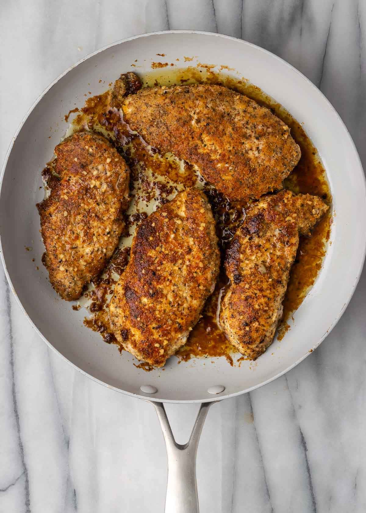 breaded chicken in skillet