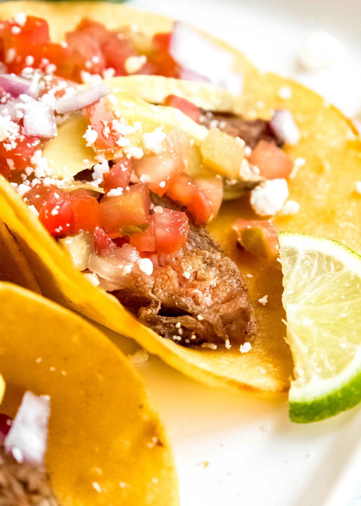 steak taco ingredients on white cutting board