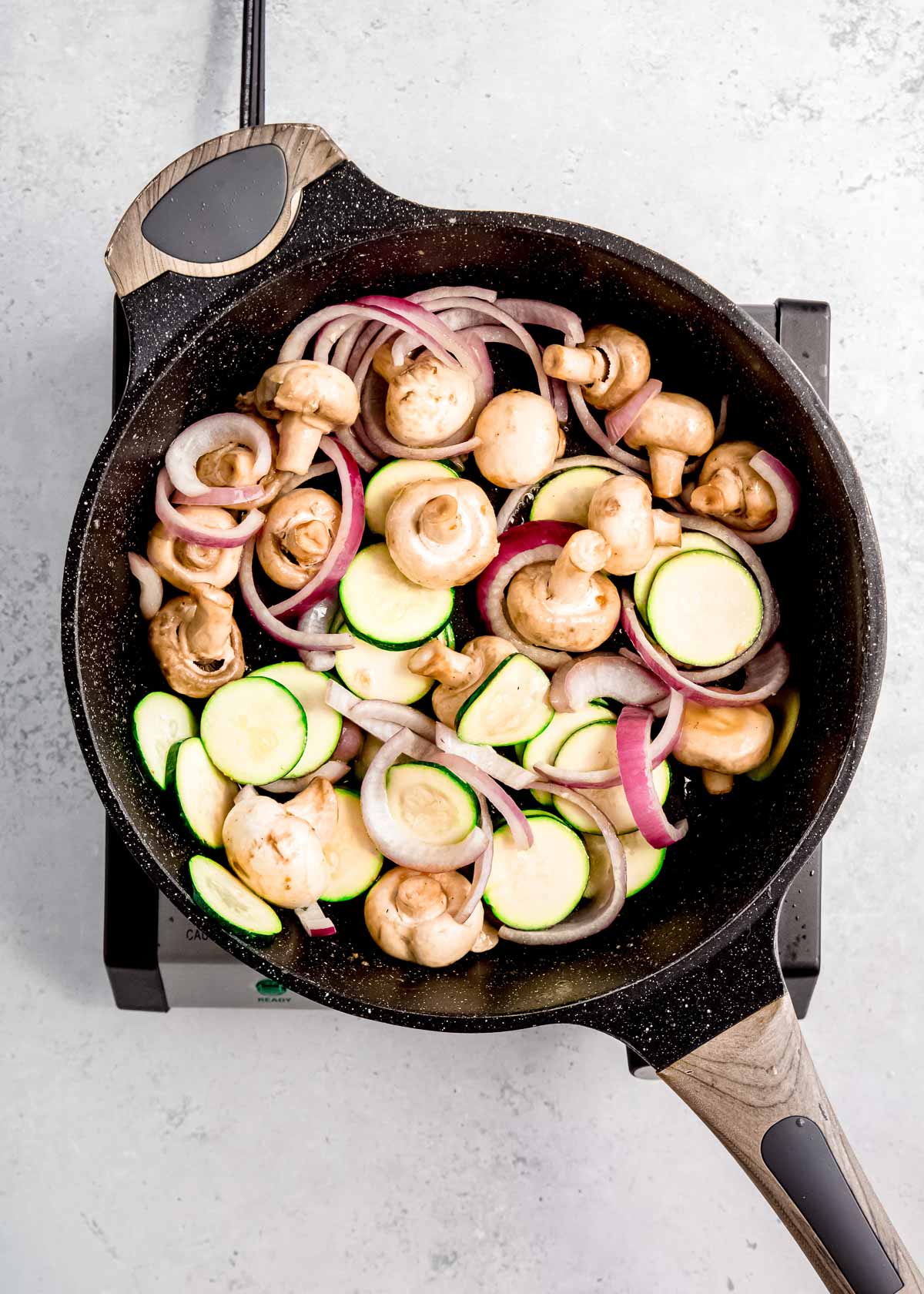 softened mushrooms, zucchini, and onions in skillet