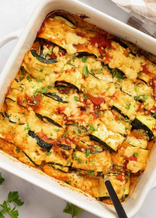 These delicious Zucchini Lasagna Rolls give you all your favorite flavors in a cheesy, creamy filling for less than 1 net carb each! This low-carb zucchini recipe is vegetarian, gluten-free, and perfect for a date night.