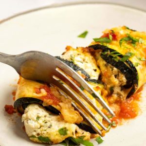 These delicious Zucchini Lasagna Rolls give you all your favorite flavors in a cheesy, creamy filling for less than 1 net carb each! This low-carb zucchini recipe is vegetarian, gluten-free, and perfect for a date night.