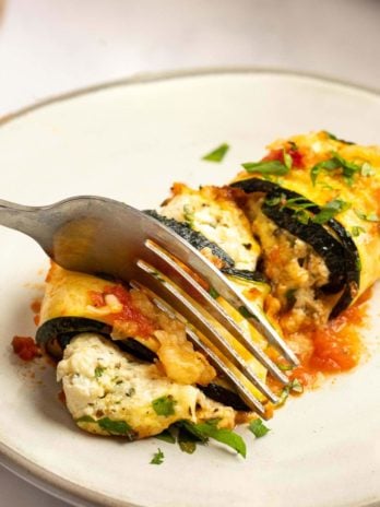 These delicious Zucchini Lasagna Rolls give you all your favorite flavors in a cheesy, creamy filling for less than 1 net carb each! This low-carb zucchini recipe is vegetarian, gluten-free, and perfect for a date night.