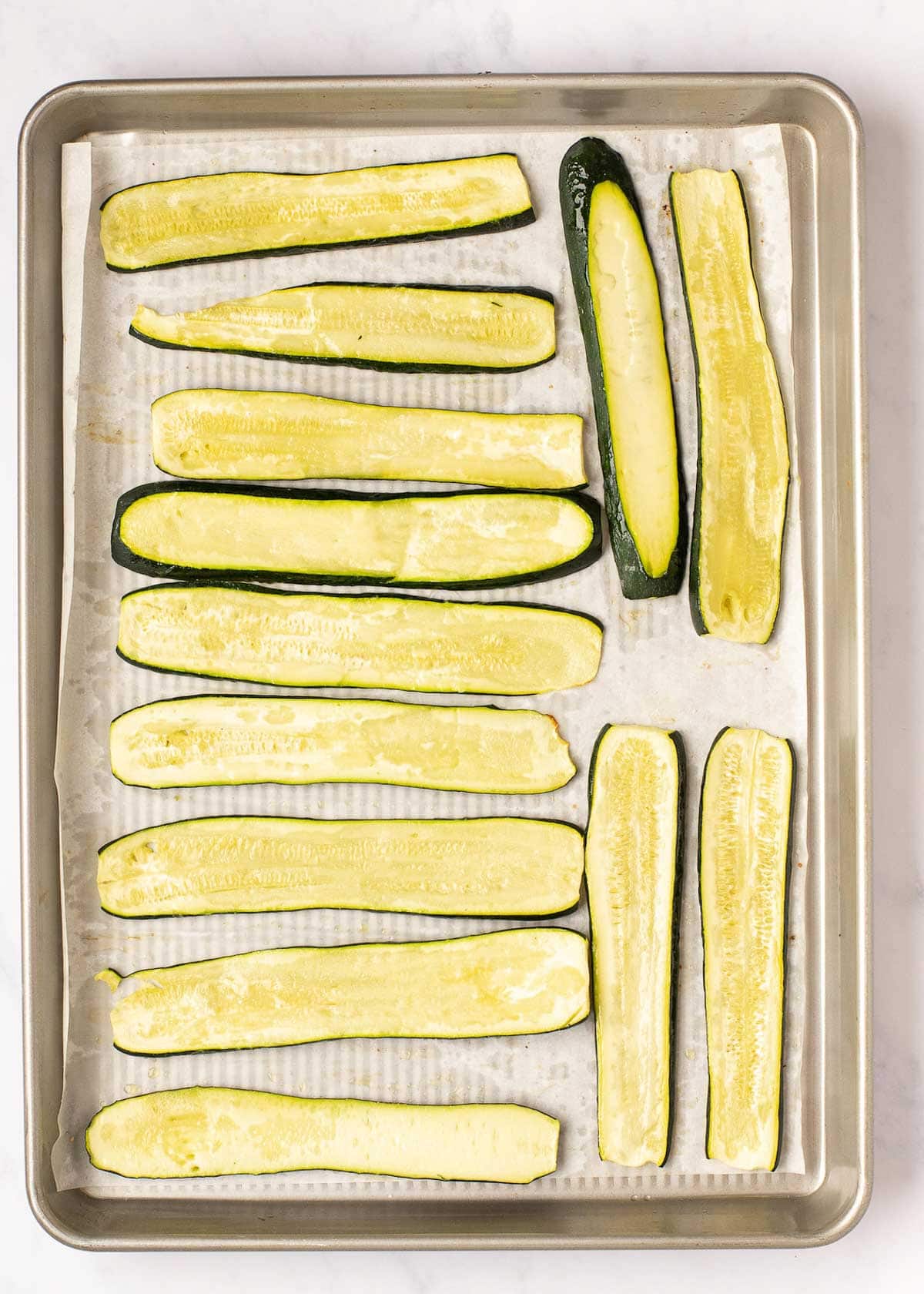 zucchini is sliced thin and baked to reduce the moisture in the recipe