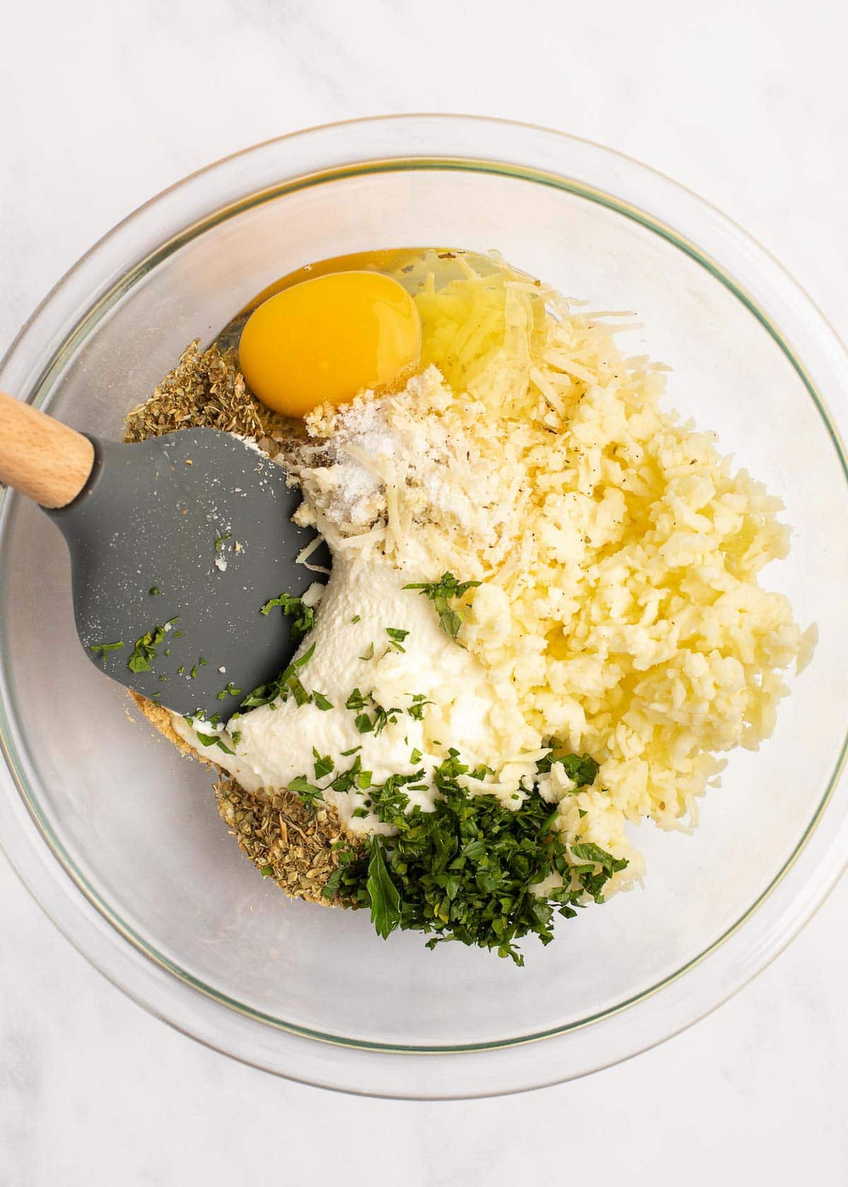 cheese filling made from ricotta, shredded mozzarella, and grated parmesan cheeses as well as spices, herbs, garlic, and an egg.