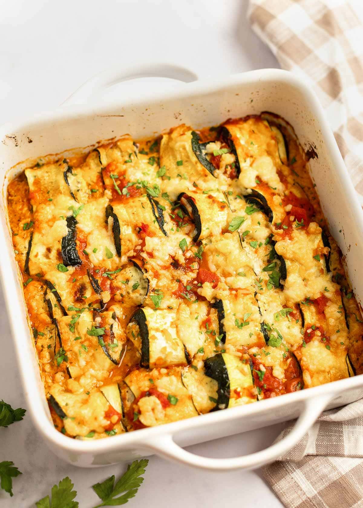 These delicious Zucchini Lasagna Rolls give you all your favorite flavors in a cheesy, creamy filling for less than 1 net carb each! This low-carb zucchini recipe is vegetarian, gluten-free, and perfect for a date night.