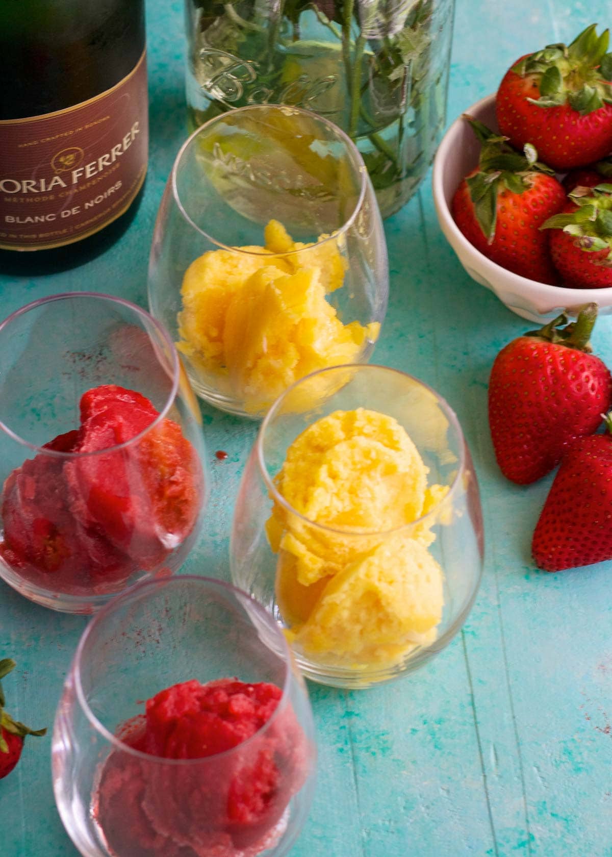 add 2 scoops of sorbet to each glass