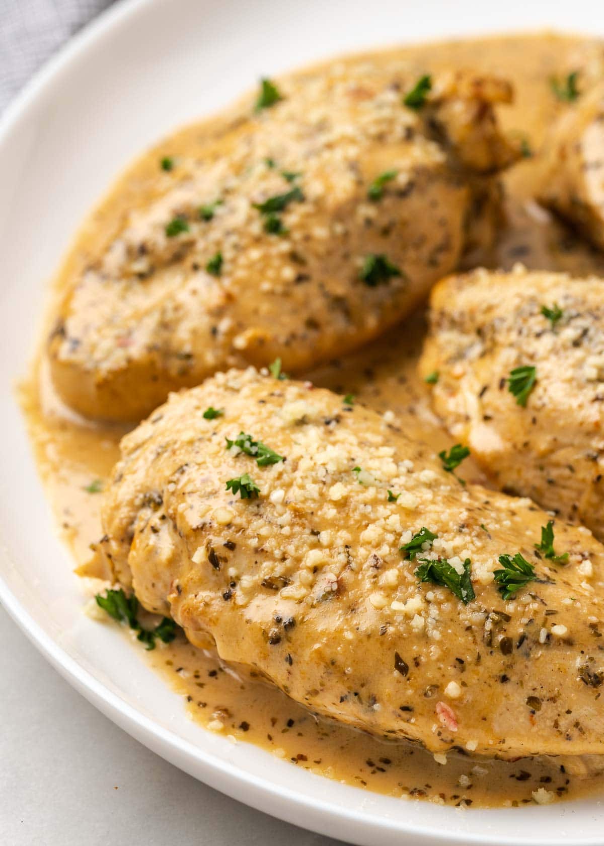 instant pot chicken breast on plate with sauce