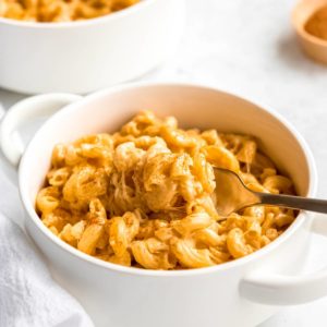 mac and cheese in a bowl with a spoon
